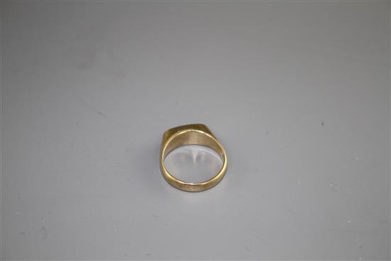 A modern 9ct gold and collet set white opal set dress ring, size M, gross weight 3.9 grams.